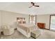 This bright bedroom boasts a ceiling fan and features natural light through several windows at 369 Rodeo Dr, Indianapolis, IN 46217