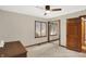 Bright bedroom featuring a ceiling fan, and a closet with mirrored doors at 369 Rodeo Dr, Indianapolis, IN 46217