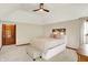 This spacious bedroom boasts a ceiling fan and features natural light through a window at 369 Rodeo Dr, Indianapolis, IN 46217