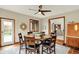 Cozy dining room features a round wooden table with seating for six and a view to the backyard at 369 Rodeo Dr, Indianapolis, IN 46217
