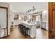 Modern kitchen featuring an island with seating, stylish lighting, and modern stainless appliances at 369 Rodeo Dr, Indianapolis, IN 46217