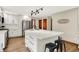 Bright kitchen with stainless steel appliances, a center island, and sleek, white cabinets at 369 Rodeo Dr, Indianapolis, IN 46217