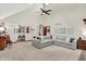 Spacious living room with open sight lines into the kitchen featuring an island with seating at 369 Rodeo Dr, Indianapolis, IN 46217