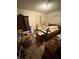 Bedroom featuring hardwood floors, an antique bed frame and an armoire at 3709 N Layman Ave, Indianapolis, IN 46218