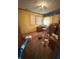 Bedroom with hardwood flooring, neutral window coverings, and a dresser set at 3709 N Layman Ave, Indianapolis, IN 46218