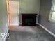Bedroom with grey carpet, walls, a fireplace, and a window allowing an abundance of natural light at 3815 Briar Rdg, Monrovia, IN 46157