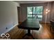 Dining area with hardwood floors, a large table, and a bright window at 3815 Briar Rdg, Monrovia, IN 46157
