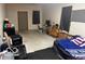 Spacious garage with large door, concrete flooring, TV, and storage cabinets at 3815 Briar Rdg, Monrovia, IN 46157