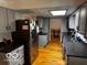 Bright kitchen featuring gray cabinets, stainless steel appliances, and hardwood floors at 3815 Briar Rdg, Monrovia, IN 46157