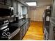 Spacious kitchen with gray cabinets, stainless steel appliances, and plenty of counter space at 3815 Briar Rdg, Monrovia, IN 46157