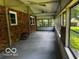 Enclosed sunroom featuring brick walls and windowed walls providing plenty of natural light at 3815 Briar Rdg, Monrovia, IN 46157