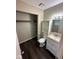 Bathroom featuring a vanity, toilet, linen storage, and a closet at 4405 Phoenix Dr, Indianapolis, IN 46241