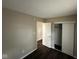 A neutral-toned bedroom with hardwood floors and closet space at 4405 Phoenix Dr, Indianapolis, IN 46241