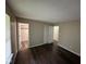 Bedroom showcasing hardwood floors, closet, and a window for ample natural light at 4405 Phoenix Dr, Indianapolis, IN 46241