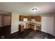 Traditional kitchen featuring wood cabinets, laminate countertops, and hardwood floors at 4405 Phoenix Dr, Indianapolis, IN 46241