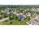 Picturesque aerial view of a residential neighborhood with lush greenery and well-maintained homes at 4465 W Woodbridge Ln, New Palestine, IN 46163