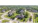 An aerial view of a neighborhood showcasing lush greenery and well-maintained homes in a suburban setting at 4465 W Woodbridge Ln, New Palestine, IN 46163