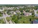Aerial view of a community with diverse homes, mature trees, and meticulously kept yards at 4465 W Woodbridge Ln, New Palestine, IN 46163