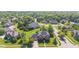 Aerial of a neighborhood showcasing large homes and lush landscaping, creating a picturesque community at 4465 W Woodbridge Ln, New Palestine, IN 46163
