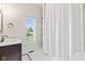 A full bathroom with a shower and a decorative shower curtain at 4465 W Woodbridge Ln, New Palestine, IN 46163