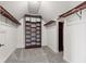 Spacious walk-in closet with built in shelving and carpet flooring at 4465 W Woodbridge Ln, New Palestine, IN 46163