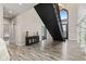 Grand foyer featuring high ceilings, staircase, and view of the front door and decorative console table at 4465 W Woodbridge Ln, New Palestine, IN 46163