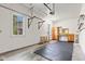 Well-lit garage featuring natural light from windows and a custom workbench at 4465 W Woodbridge Ln, New Palestine, IN 46163