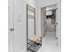 Hallway with metal and wood bench and tile floor at 4465 W Woodbridge Ln, New Palestine, IN 46163