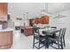 Spacious kitchen featuring a large center island, wood cabinets, and adjacent breakfast nook at 4465 W Woodbridge Ln, New Palestine, IN 46163