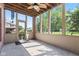 Outdoor screened in porch with ceiling fan, perfect for relaxing and entertaining guests at 4465 W Woodbridge Ln, New Palestine, IN 46163