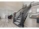 View of a staircase that connects the dining room and living room at 4465 W Woodbridge Ln, New Palestine, IN 46163