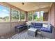 Cozy sunroom with large windows and comfortable seating at 4465 W Woodbridge Ln, New Palestine, IN 46163