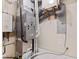 Basement utility area features a high-efficiency furnace and a modern hot water heater system at 4465 W Woodbridge Ln, New Palestine, IN 46163
