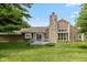 The Backyard boasts a deck and stone chimney, perfect for relaxing and entertaining outdoors at 4609 Framington Ct, Indianapolis, IN 46254