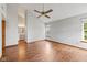 Spacious bedroom with light-filled interior, wood flooring, ceiling fan and an ensuite bath at 4609 Framington Ct, Indianapolis, IN 46254