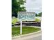 Rick's Cafe Boatyard sign with vibrant flowers and greenery in front of the street at 4609 Framington Ct, Indianapolis, IN 46254