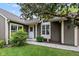 Inviting front entrance with a white door, well-manicured lawn, and mature shrubbery at 4609 Framington Ct, Indianapolis, IN 46254