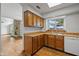 Well-lit kitchen features butcher block countertops, wood cabinets and modern white appliances at 4609 Framington Ct, Indianapolis, IN 46254