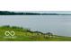 Scenic view of the lake with sailboats visible from the grassy shoreline at 4609 Framington Ct, Indianapolis, IN 46254
