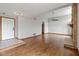 Inviting open-concept living room with wood floors, stone fireplace and bright natural light at 4609 Framington Ct, Indianapolis, IN 46254