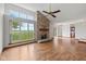Bright living room with stone fireplace, large windows, and an inviting, open floor plan at 4609 Framington Ct, Indianapolis, IN 46254