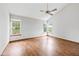 Sunlit main bedroom boasts hardwood floors and two sets of windows providing ample natural light at 4609 Framington Ct, Indianapolis, IN 46254