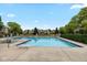 The community pool is surrounded by lounge chairs and trees at 4609 Framington Ct, Indianapolis, IN 46254