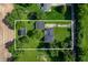 Aerial view showcasing the home's layout, large lot, detached garage and surrounding greenery at 5081 N 500 W, Fairland, IN 46126