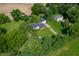 Beautiful aerial view of the house and grounds surrounded by lush trees and manicured lawns at 5081 N 500 W, Fairland, IN 46126