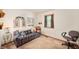 Cozy bedroom with plaid couch, plush toys, and natural light from a window with wooden trim at 5081 N 500 W, Fairland, IN 46126
