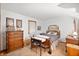 Comfortable bedroom with a bed, dresser, desk, and complementary decor at 5081 N 500 W, Fairland, IN 46126