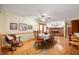 Inviting dining room featuring hardwood floors, fireplace, with wooden dining table set and decor at 5081 N 500 W, Fairland, IN 46126