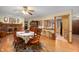 Inviting dining room featuring hardwood floors, fireplace, with wooden dining table set and decor at 5081 N 500 W, Fairland, IN 46126