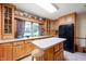 Bright kitchen with light wood cabinets, skylight, decor, and a central island with stool at 5081 N 500 W, Fairland, IN 46126